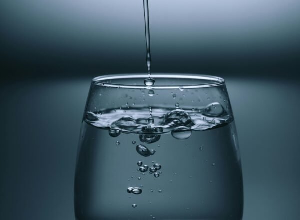 A glass of water on a calm table