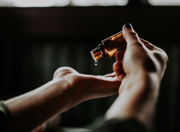 Hands applying a skin-care product