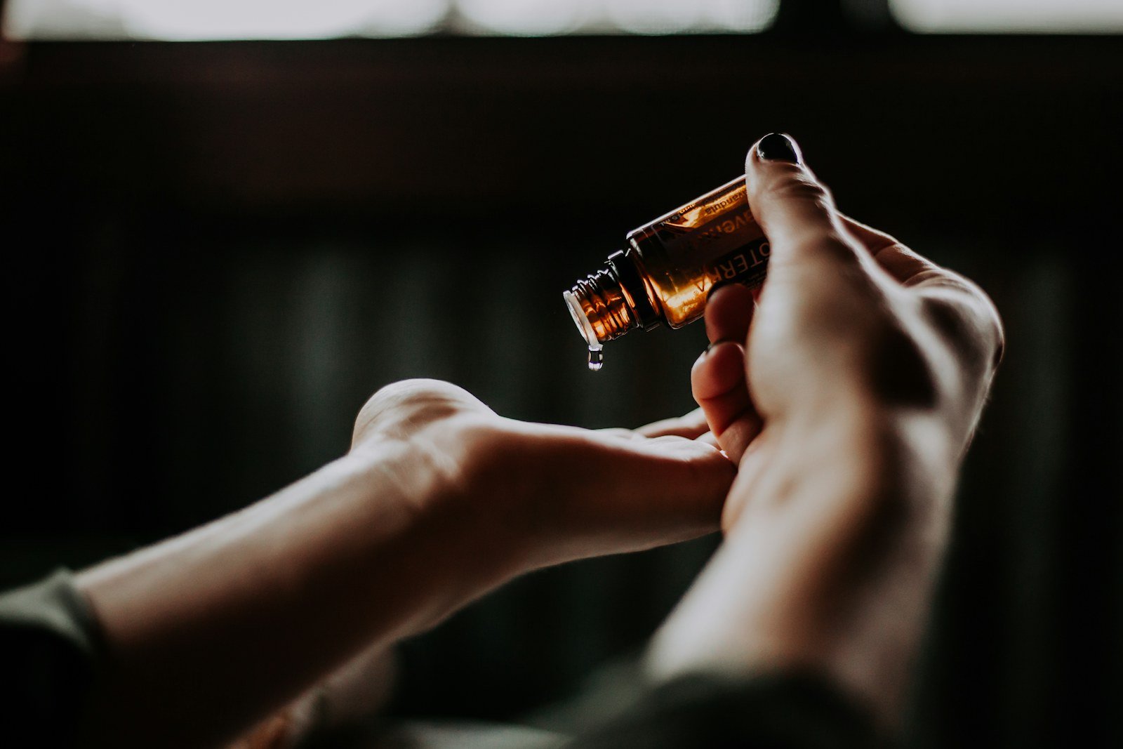 Hands applying a skin-care product