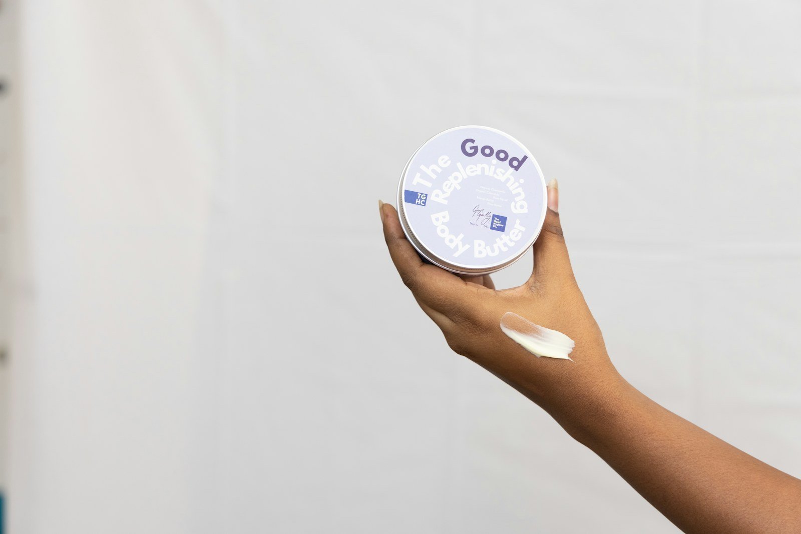 Hands applying cream as part of a skin-care routine
